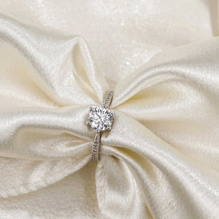 Close-up detail of dazzling classic moissanite six prong engagement ring