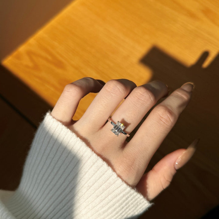 2ct emerald Solitaire Engagement Rings with moissanite worn on hand