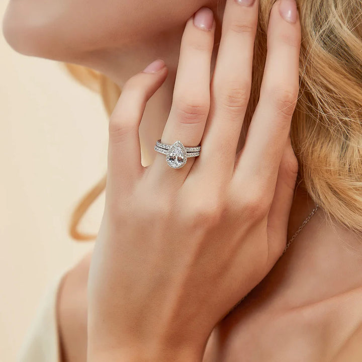 Affordable Pear halo engagement ring on hand