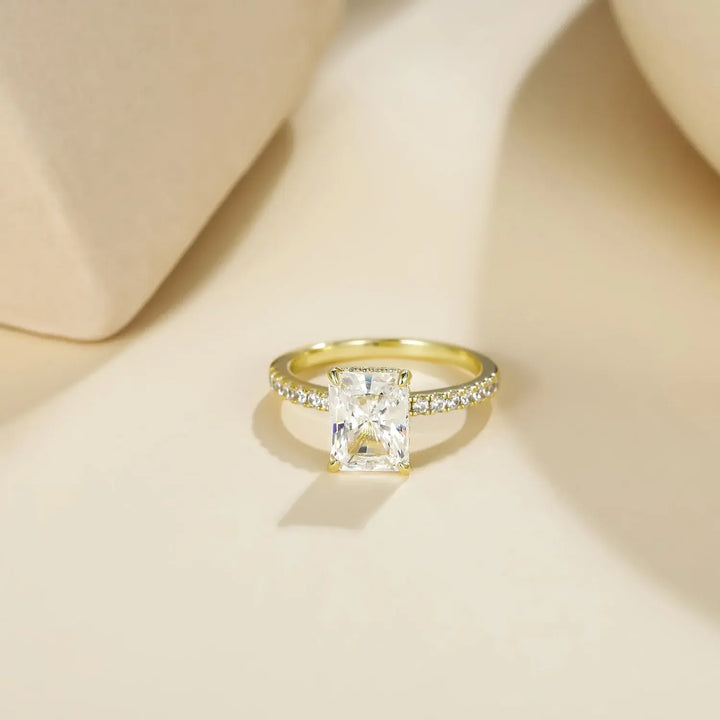 Gold low profile engagement rings with Radiant Moissanite