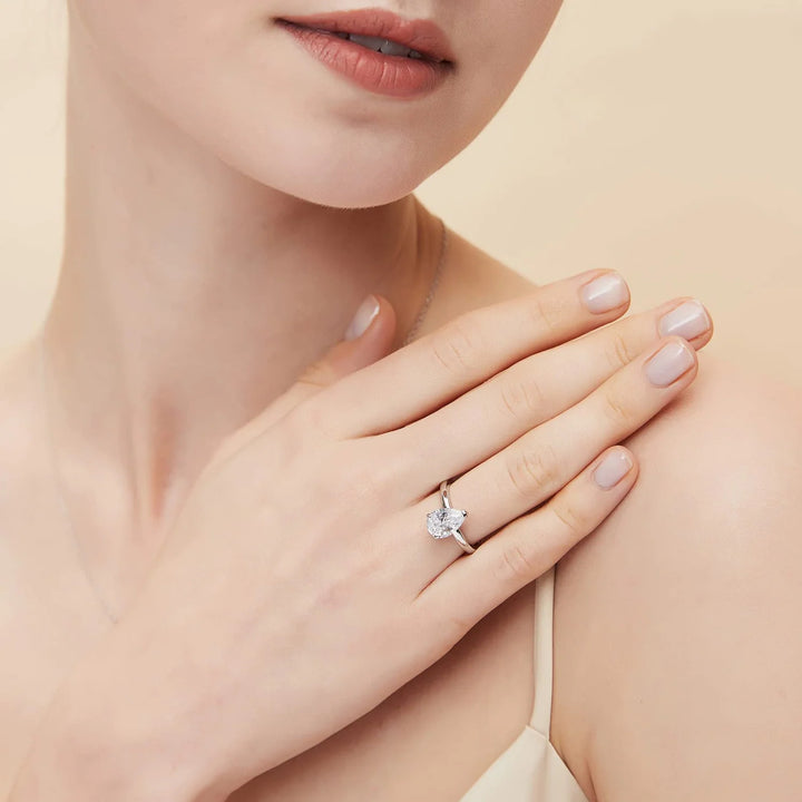 Affordable 2ct pear moissanite engagement ring worn on hand