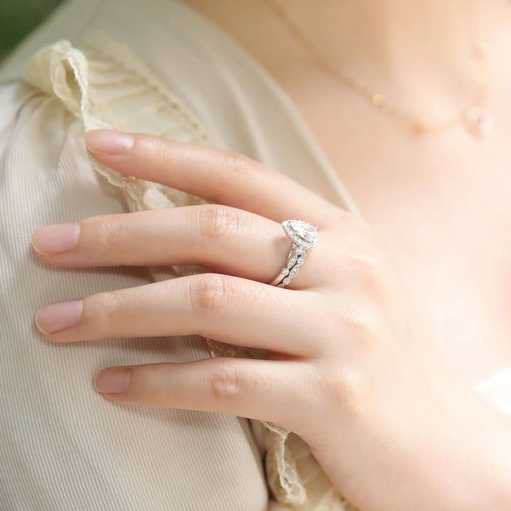 silver affordable halo engagement ring worn on hand