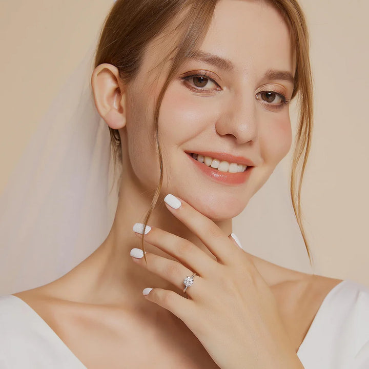 affordable round cut solitaire engagement ring worn on hand