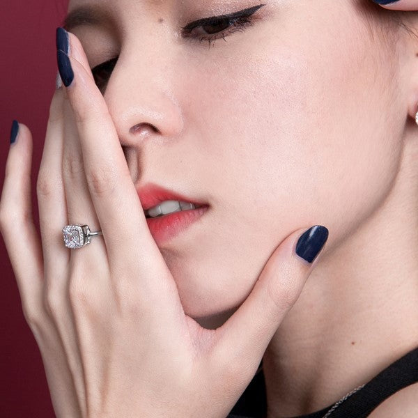 Affordable sterling silver 1ct moissanite engagement ring worn on hand