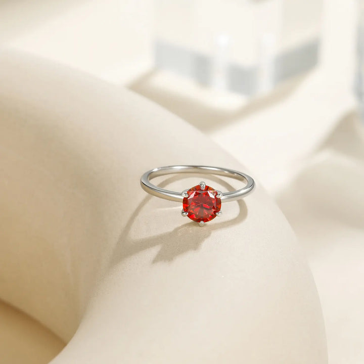 Close-up detail of classic garnet solitaire engagement ring