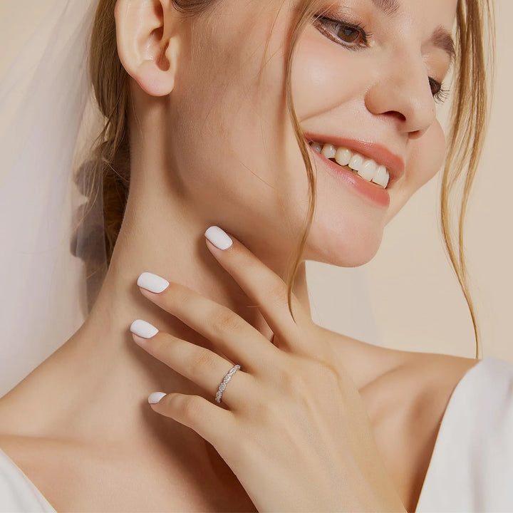 curved wedding band worn on hand