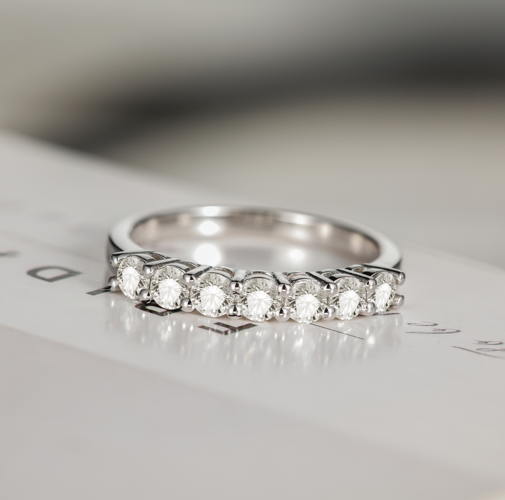 dazzling round moissanite engagement band