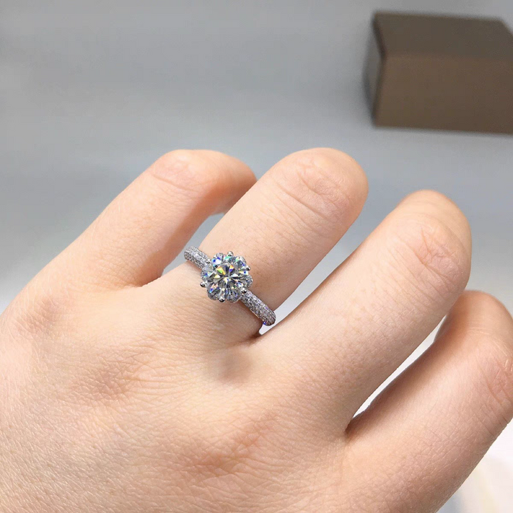 floral 1 carat moissanite ring on hand