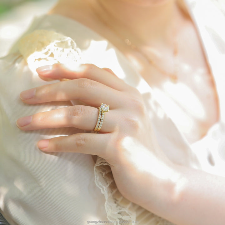 gold moissanite bridal sets worn on hand