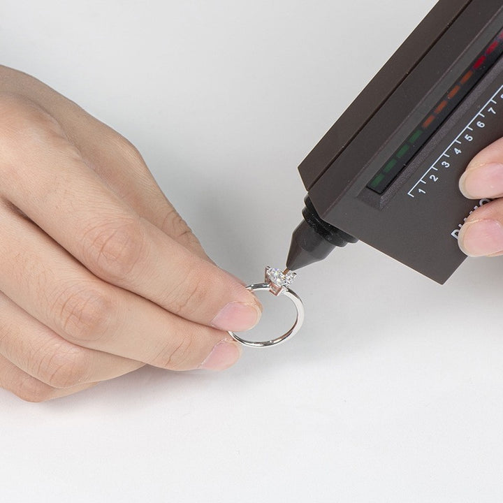 A drill bit is used to measure heart-shaped moissanite