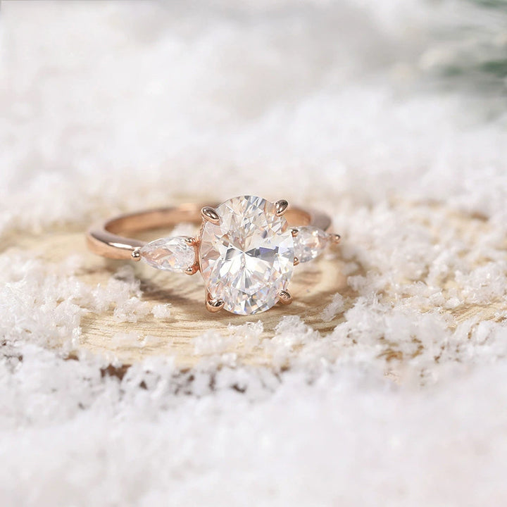 rose gold cz three stone engagement ring