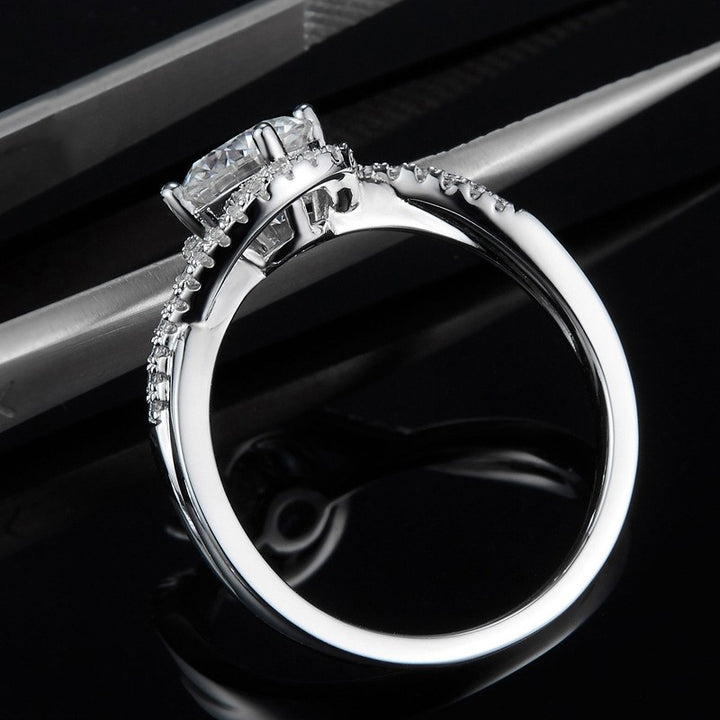 Side view of round cut low profile engagement ring