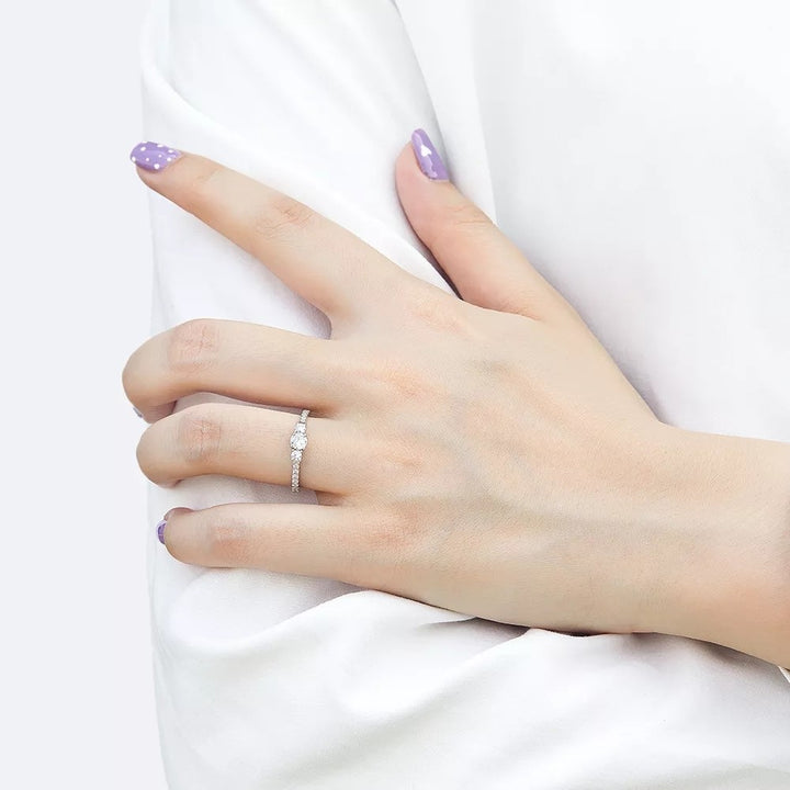 Three stone engagement ring worn on hand