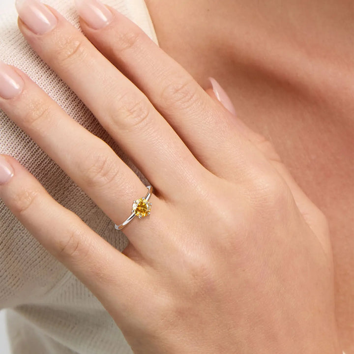 Yellow gemstone moissanite solitaire engagement rings worn on hand