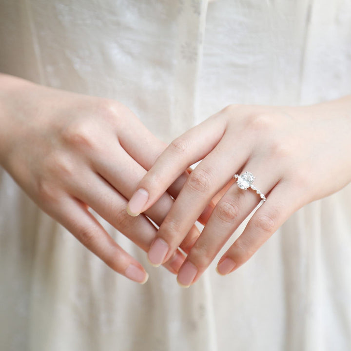 Affordable 3ct oval cut moissanite engagement ring worn on hand