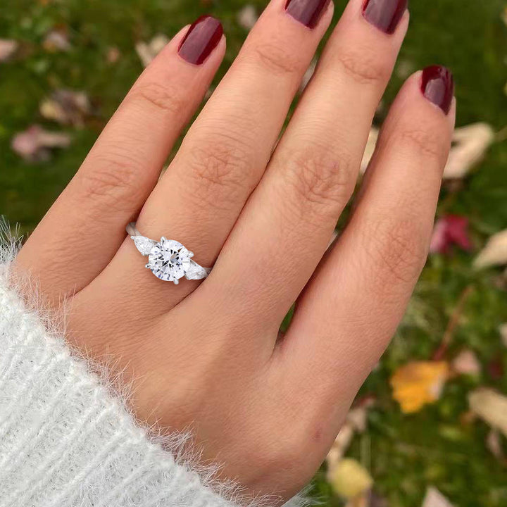 affordable dazzling three stone engagement rings  worn on hand